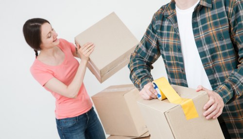 Packed household boxes and furniture prepared for removal service