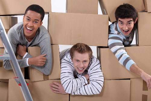 Preparing boxes and furniture for a moving truck in Hithergreen