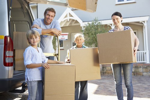 Careful wrapping and boxing of household items by a local moving team