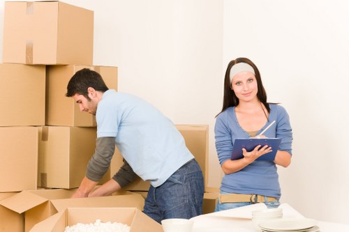 Careful loading of household items by a man and van team